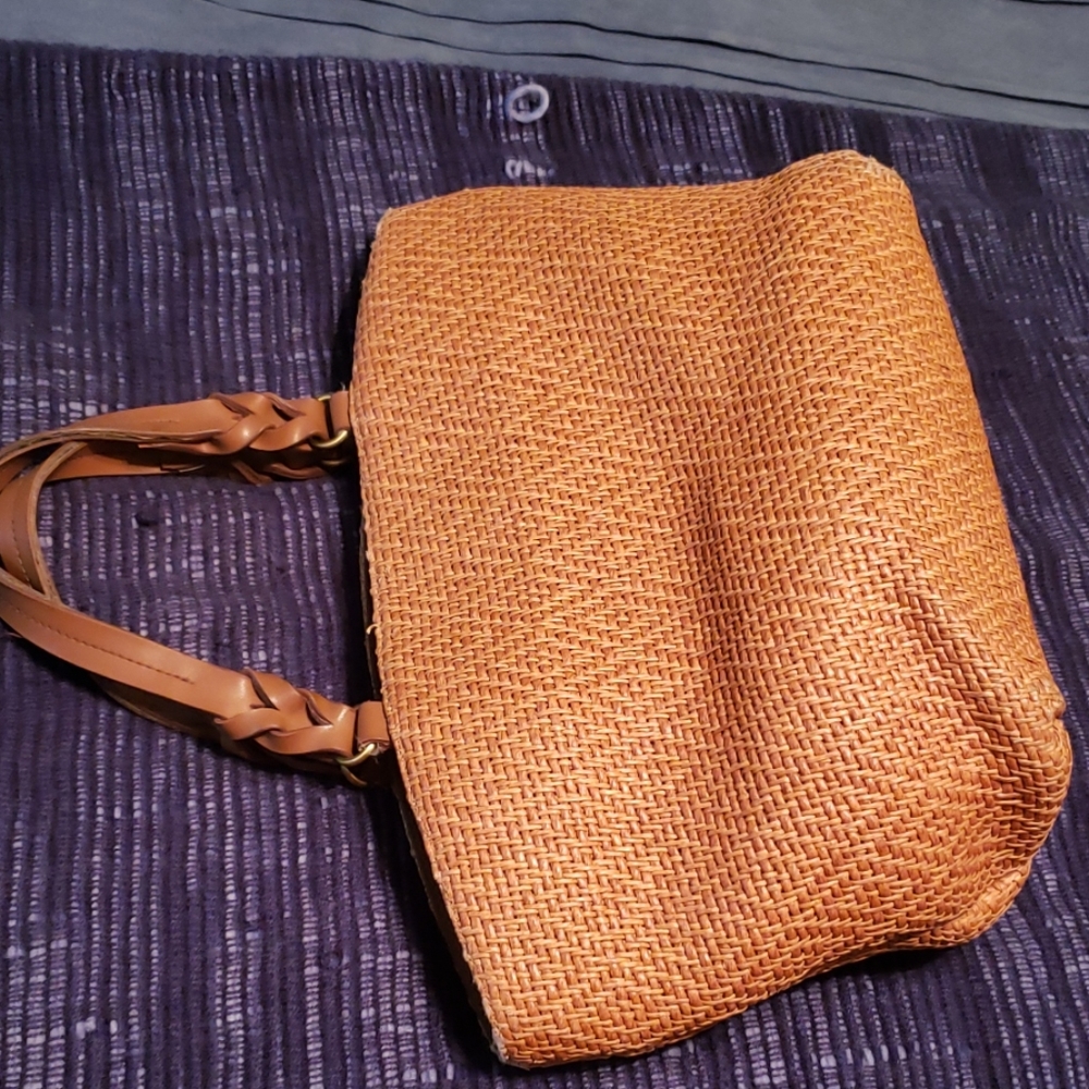 Fossil roomy faux straw tote.